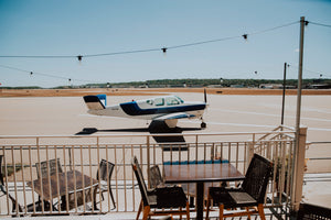 Planes will taxi in this close to your table, allowing you to admire them while their passengers unload.